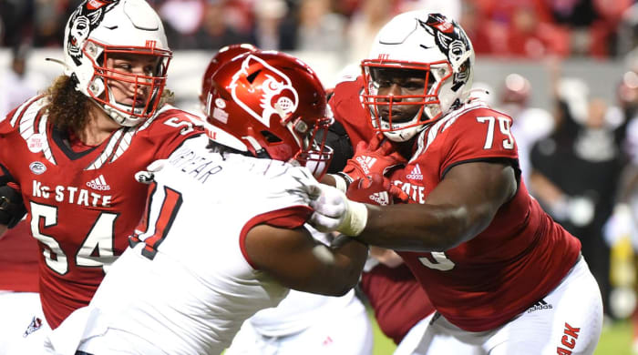 Oct 30, 2021; Raleigh, North Carolina, USA; North Carolina State Wolfpack tackle Ikem Ekwonu (79) blocks during the first half against the Louisville Cardinals at Carter-Finley Stadium.